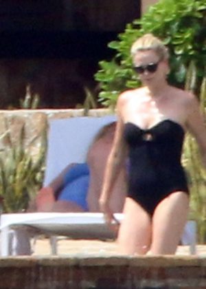 Charlize Theron in Black Swimsuit on vacation in Los Cabos